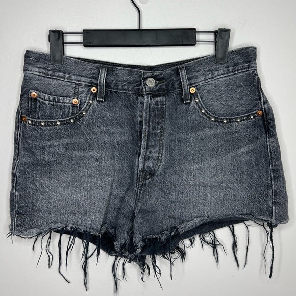 Levi's Pants - Levi’s high rise distressed black washed jean shots with grommets. Button fly.